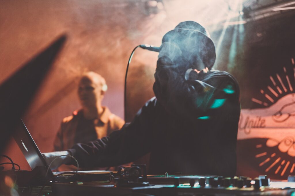 concert, dj, festival, laptop, leather jacket, light rays, men, microphone, musician, people, performance, singer, smoke, stage, stage lights, live performance, concert, concert, concert, concert, festival, festival, festival, festival, men, microphone, microphone, musician, musician, singer, singer, singer, singer, singer